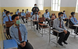 students in a classroom to symbolize In the BISE Lahore Matric exams, 707 students achieved a perfect score of 1100 out of 1100, showcasing exceptional academic performance this year