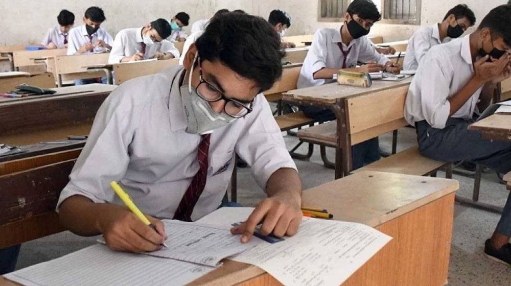 students giving exams in a examination hall to symbolize Sindh Passes All Matric And Intermediate Students in Practical Exams