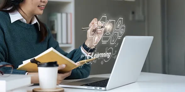 A girl learning online on a laptop