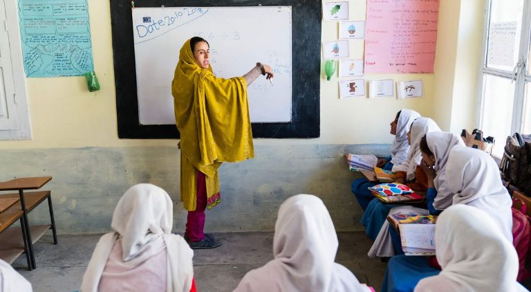 image of primary school teacher teaching in a class