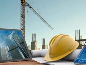 Engineering tools including a yellow hard hat, calipers, and a phone, a tablet representing ECAT Computer Science