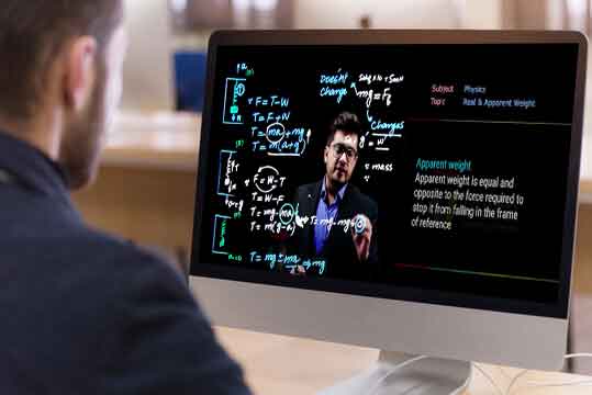 image of student with computer screen learning online